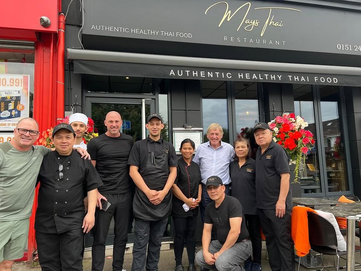 The May's Thai team outside the restaurant with Sir Kenny Dalglish